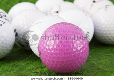 stock-photo-pink-and-white-golf-balls-on-green-14604649.jpg